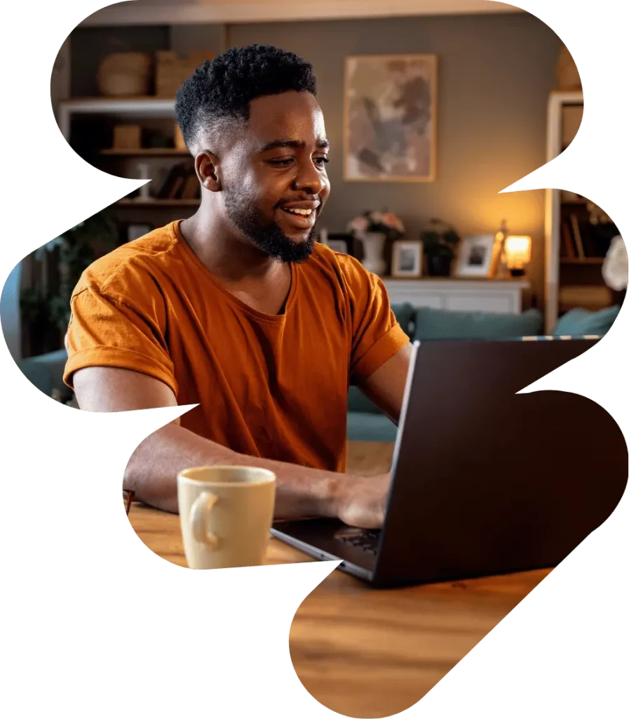 A man typing in his laptop